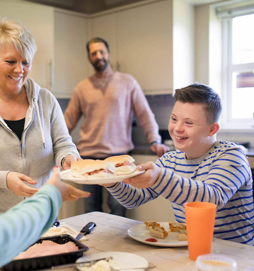 young person in kitchen